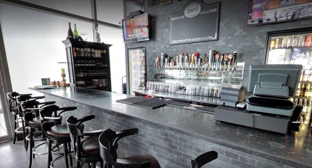 Custom antiqued mirror inside a bar