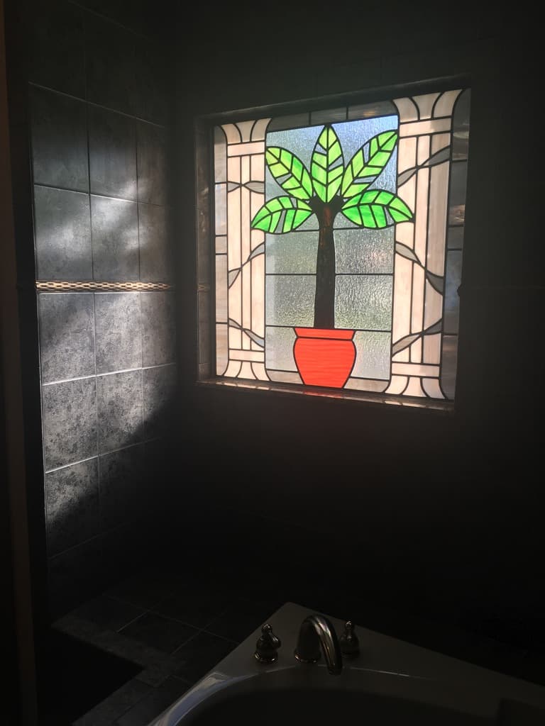 Stained glass bathroom window design from the interior of a home