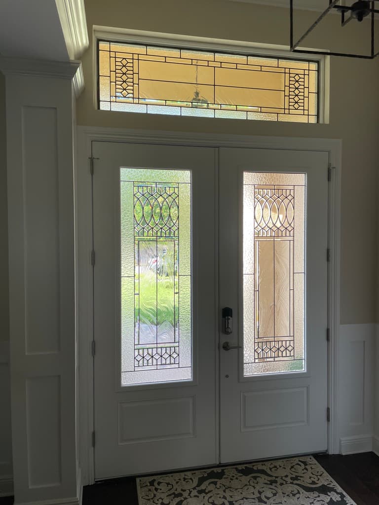 Stained glass door design viewed from the interior of a home