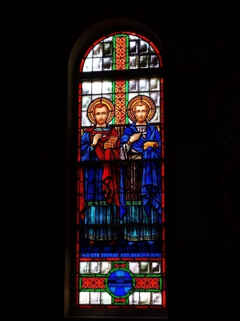 Stained glass church window design viewed from the interior of a church